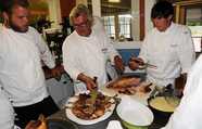 Master Chef Yvon Gros teaching students how to properly prepare duck
